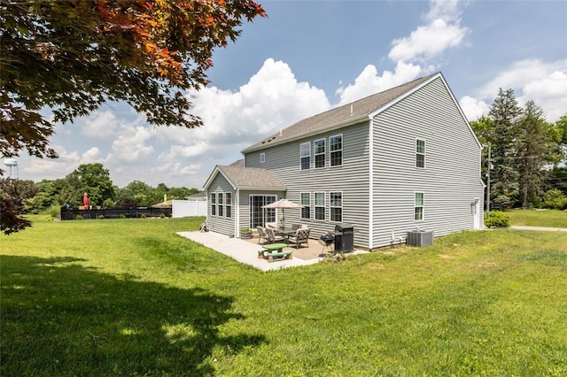 294 Connoquenessing Main St, Connoquenessing Boro, PA 16033 - back of house featuring a lawn, a patio area, and a shingled roof