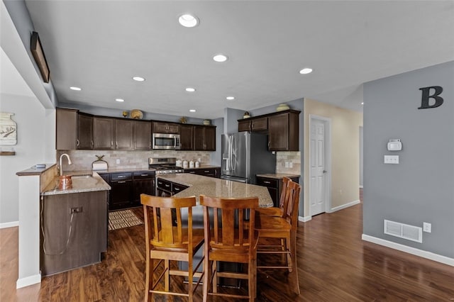 294 Connoquenessing Main St, Connoquenessing Boro, PA 16033 - dining space with dark wood-type flooring and recessed lighting