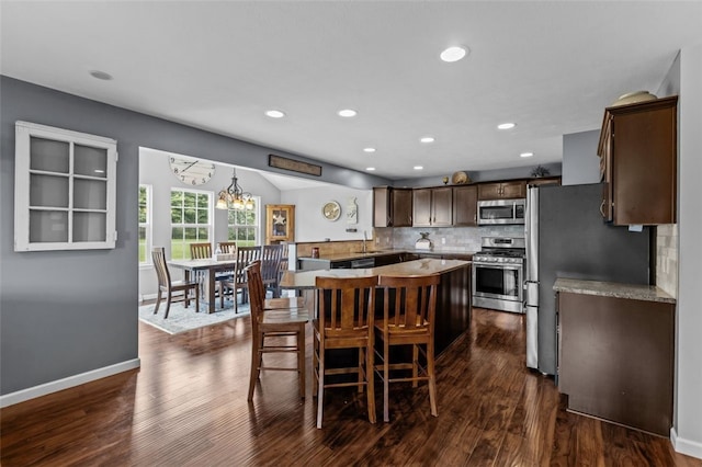 294 Connoquenessing Main St, Connoquenessing Boro, PA 16033 - dining space featuring dark wood-type flooring, recessed lighting, a chandelier, and vaulted ceiling