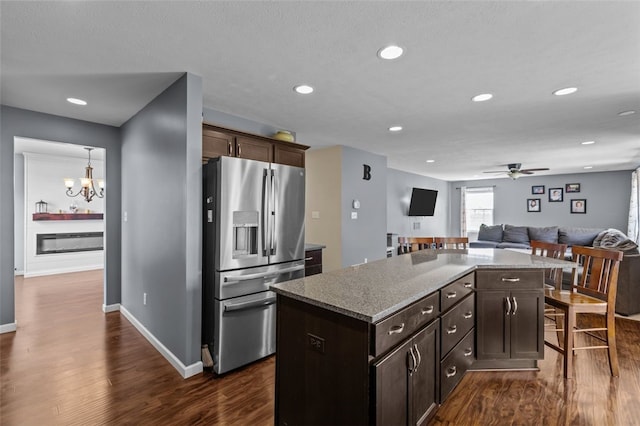 294 Connoquenessing Main St, Connoquenessing Boro, PA 16033 - kitchen with stainless steel fridge, a ceiling fan, dark wood finished floors, a center island, and open floor plan