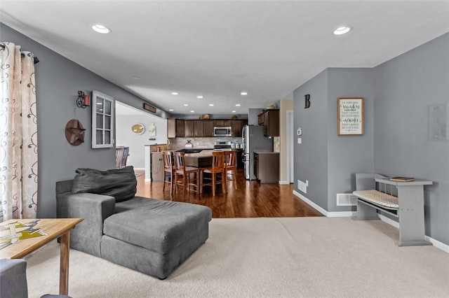294 Connoquenessing Main St, Connoquenessing Boro, PA 16033 - living area featuring recessed lighting, dark carpet, and dark wood-type flooring