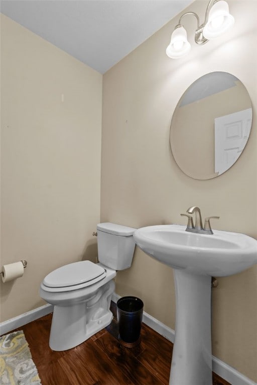 294 Connoquenessing Main St, Connoquenessing Boro, PA 16033 - bathroom featuring baseboards and wood finished floors