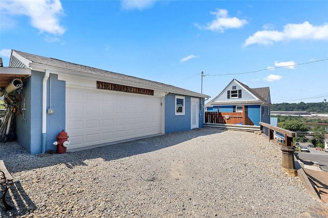 1101 6th Ave, Freedom, PA 15042 - view of front of property featuring concrete block siding, a garage, and an outdoor structure