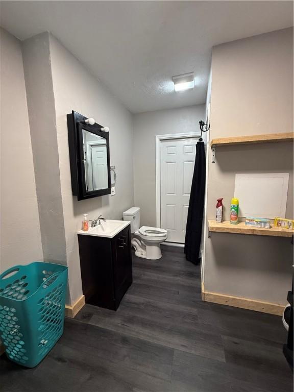 6028 Davidson Rd, Jamestown, PA 16134 - full bath with wood finished floors, vanity, and a shower with shower curtain