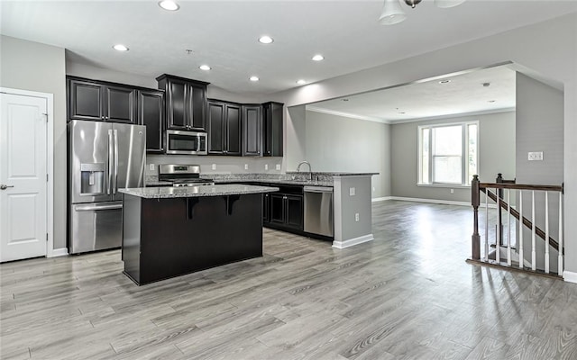 400 Fairmont Dr, Marshall, PA 15090 - kitchen with stainless steel appliances, open floor plan, a kitchen island, a breakfast bar, and dark cabinetry