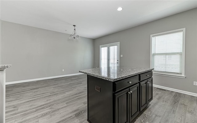 400 Fairmont Dr, Marshall, PA 15090 - kitchen with dark cabinetry, light wood finished floors, light stone countertops, a kitchen island, and recessed lighting