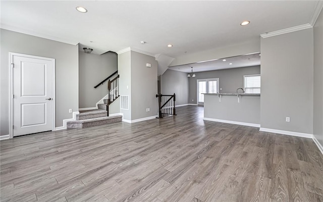 400 Fairmont Dr, Marshall, PA 15090 - unfurnished living room featuring wood finished floors, recessed lighting, crown molding, and stairway