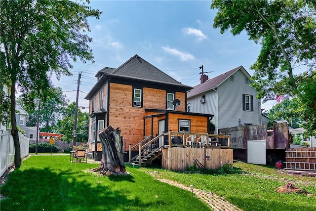 110 Pattison St, Evans City Boro, PA 16033 - back of property featuring a fenced backyard, stairway, and a wooden deck