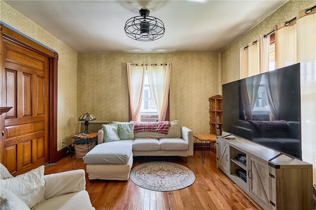 110 Pattison St, Evans City Boro, PA 16033 - living area with wallpapered walls and light wood finished floors