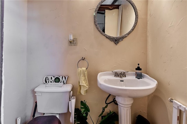 110 Pattison St, Evans City Boro, PA 16033 - half bath with toilet and radiator heating unit