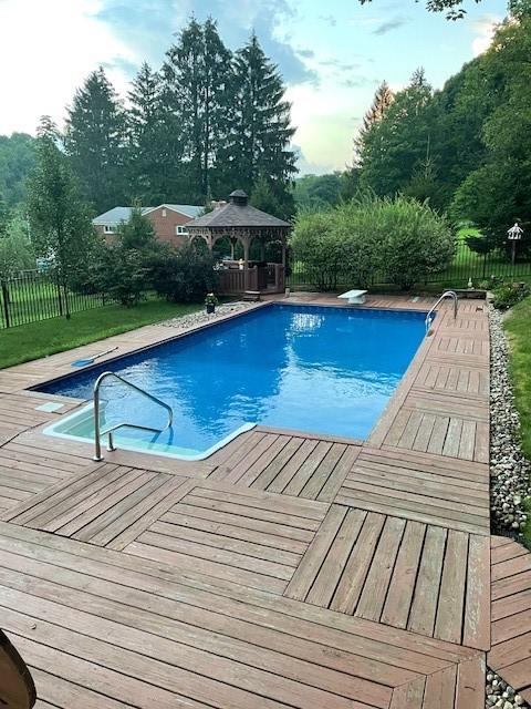 3912 Milton Dr, Richland, PA 15044 - view of pool with a gazebo, a fenced backyard, and a deck
