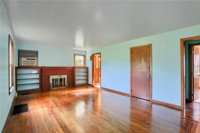 5684 Sandy Lake Polk, Sandy Lake Twp, PA 16145 - unfurnished living room featuring wood finished floors, a fireplace, and cooling unit