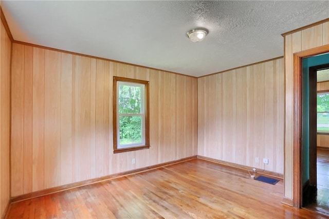 5684 Sandy Lake Polk, Sandy Lake Twp, PA 16145 - unfurnished room with wood finished floors, wood walls, and crown molding