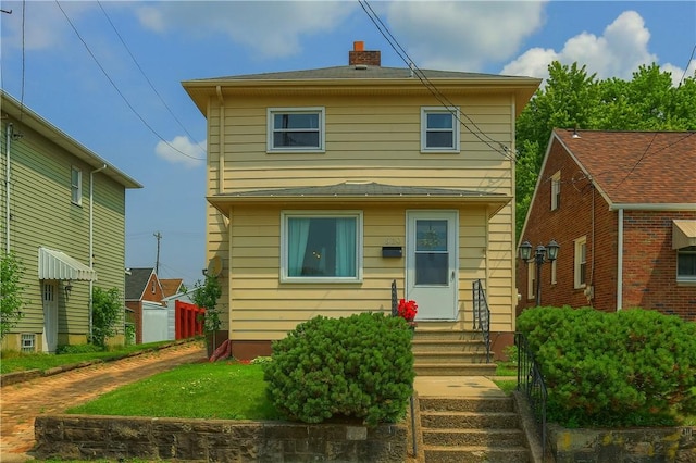 520 38th St, Beaver Falls, PA 15010 - rear view of house with entry steps and a chimney