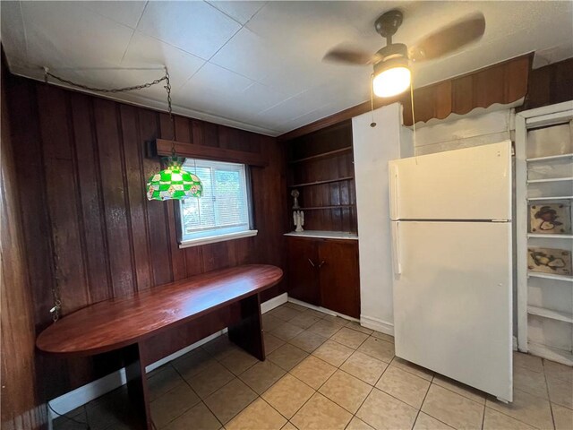 2220 Cronemeyer St, Mckeesport, PA 15132 - dining space featuring wood walls, light tile patterned flooring, and ceiling fan