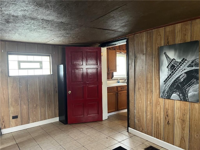2220 Cronemeyer St, Mckeesport, PA 15132 - entryway with wood walls and light tile patterned floors
