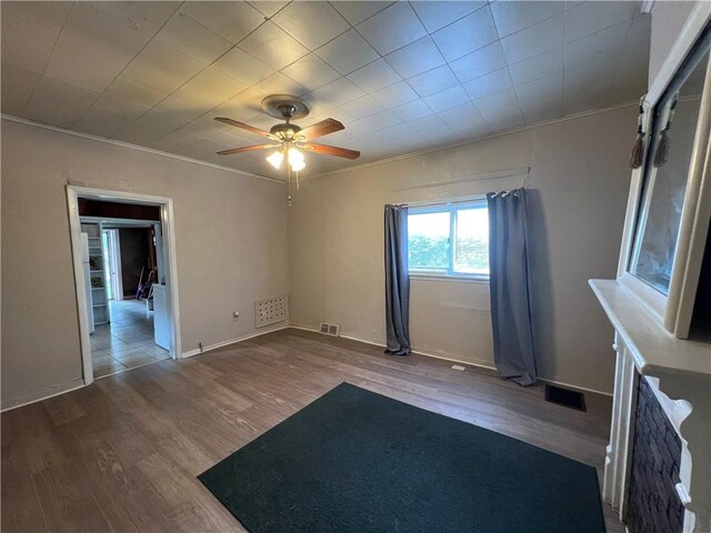 2220 Cronemeyer St, Mckeesport, PA 15132 - spare room featuring wood finished floors, ceiling fan, and ornamental molding