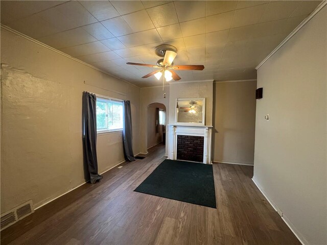 2220 Cronemeyer St, Mckeesport, PA 15132 - unfurnished living room with arched walkways, ornamental molding, a fireplace, wood finished floors, and ceiling fan