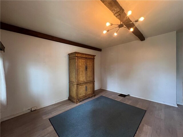 2220 Cronemeyer St, Mckeesport, PA 15132 - unfurnished room with beam ceiling, a chandelier, and dark wood-type flooring