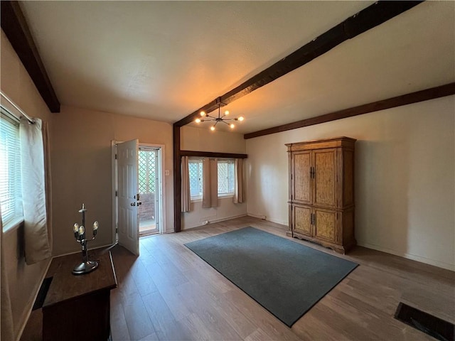 2220 Cronemeyer St, Mckeesport, PA 15132 - entrance foyer featuring beamed ceiling, a chandelier, light wood finished floors, and french doors