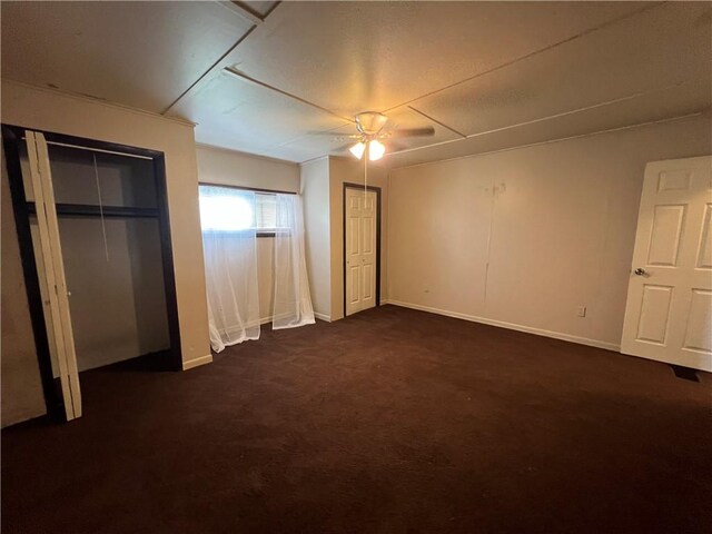 2220 Cronemeyer St, Mckeesport, PA 15132 - unfurnished bedroom featuring dark carpet, multiple closets, and a ceiling fan