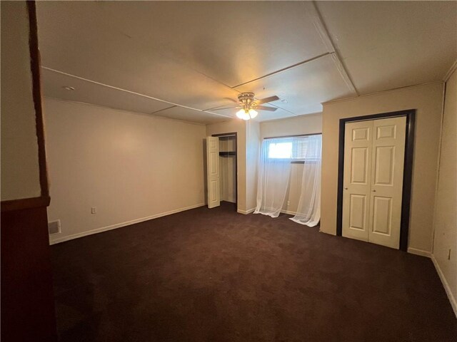 2220 Cronemeyer St, Mckeesport, PA 15132 - unfurnished bedroom featuring dark carpet and a ceiling fan