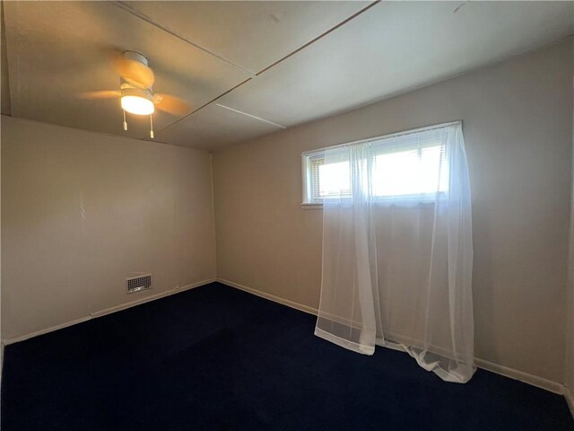 2220 Cronemeyer St, Mckeesport, PA 15132 - empty room with a ceiling fan and dark carpet