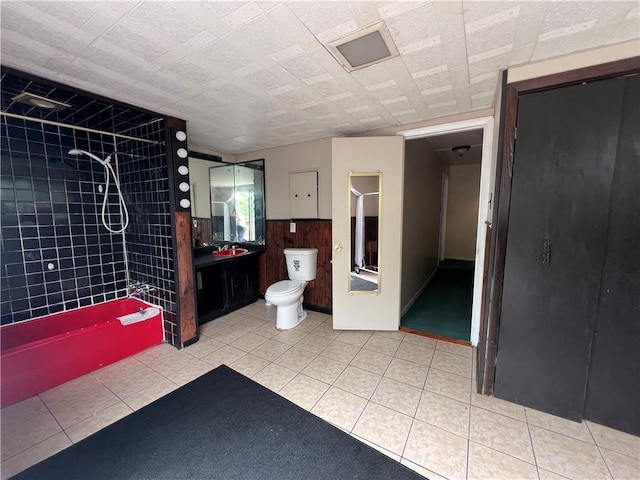 2220 Cronemeyer St, Mckeesport, PA 15132 - bathroom featuring tiled shower, vanity, wooden walls, and wainscoting