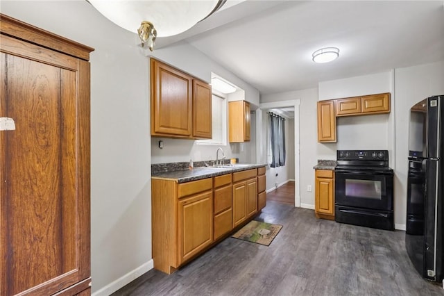 130 Pershing Blvd, Nemacolin, PA 15351 - kitchen featuring black appliances, dark wood finished floors, and dark countertops