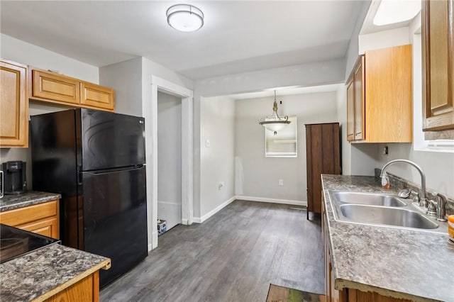 130 Pershing Blvd, Nemacolin, PA 15351 - kitchen featuring freestanding refrigerator, dark wood-style flooring, and hanging light fixtures
