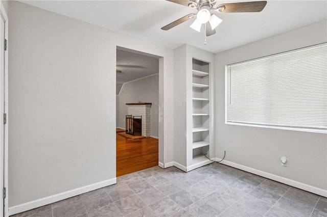 130 Pershing Blvd, Nemacolin, PA 15351 - unfurnished bedroom featuring a brick fireplace and ceiling fan