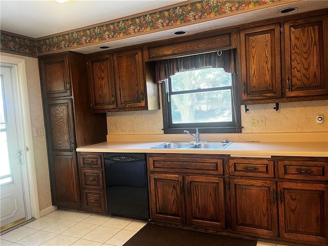 15 S 7th St, Youngwood, PA 15697 - kitchen with black dishwasher, light countertops, and light tile patterned floors
