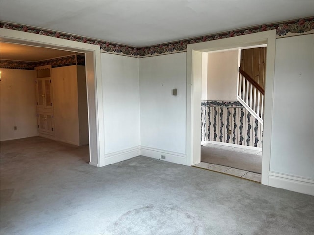 15 S 7th St, Youngwood, PA 15697 - carpeted empty room with stairs
