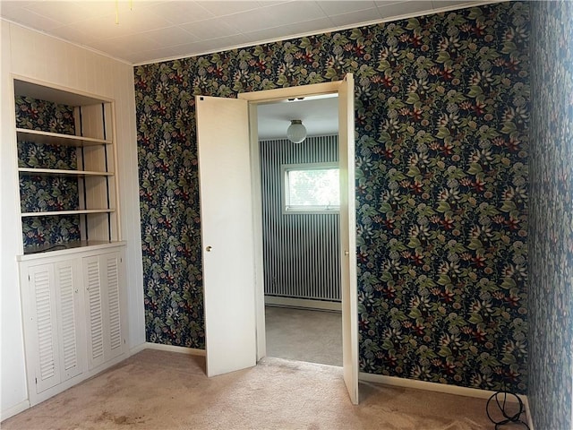 15 S 7th St, Youngwood, PA 15697 - unfurnished bedroom featuring wallpapered walls, carpet, and baseboard heating