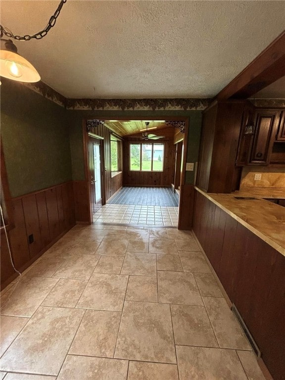 192 Yellow Creek Rd, Lancaster Twp, PA 16037 - hall with wood walls and a textured ceiling