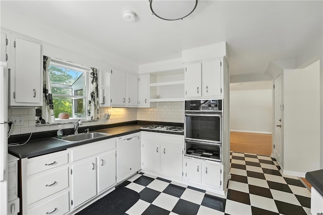 445 Pacific Ave, Forest Hills Boro, PA 15221 - kitchen with a warming drawer, oven, dark flooring, dark countertops, and white dishwasher