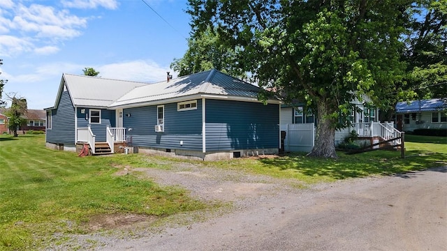 12187 Mantor St, Conneaut Lake, PA 16316 - view of front of property featuring a metal roof and a front lawn