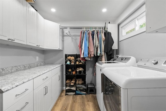 12187 Mantor St, Conneaut Lake, PA 16316 - laundry room featuring washer and dryer, cabinet space, light wood-type flooring, and recessed lighting