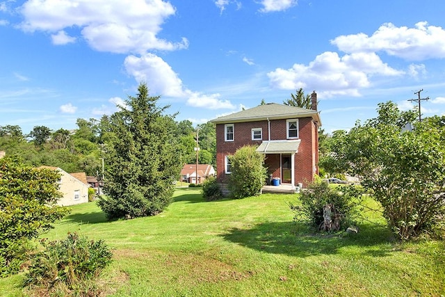 4214 Northern Pike, Monroeville, PA 15146 - back of property featuring a chimney, a lawn, and brick siding