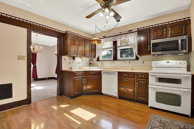 4214 Northern Pike, Monroeville, PA 15146 - kitchen with white appliances, light countertops, and light wood-type flooring