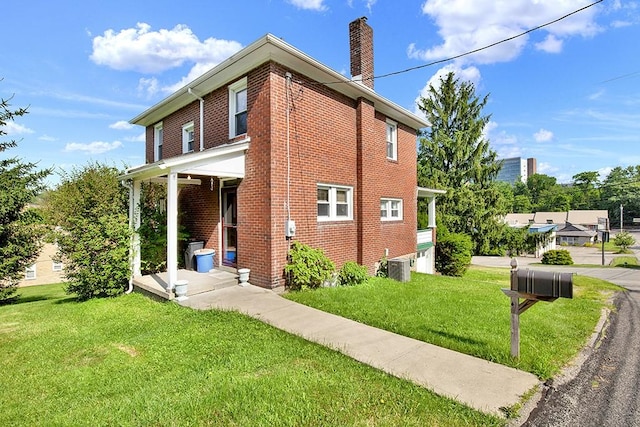 4214 Northern Pike, Monroeville, PA 15146 - view of home's exterior with brick siding, a chimney, and a yard