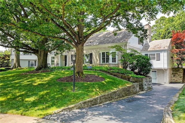 930 Valleyview Rd, Mt Lebanon, PA 15243 - view of front of home featuring brick siding, a chimney, and a front lawn