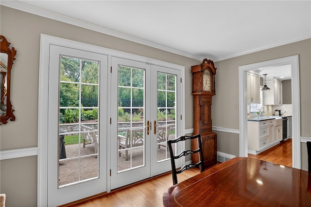 930 Valleyview Rd, Mt Lebanon, PA 15243 - doorway with french doors, plenty of natural light, light wood-type flooring, and ornamental molding