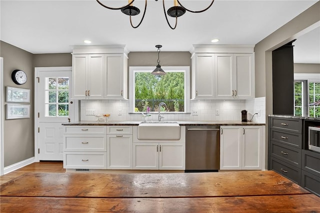 930 Valleyview Rd, Mt Lebanon, PA 15243 - kitchen with stainless steel dishwasher, white cabinetry, decorative backsplash, dark stone countertops, and recessed lighting