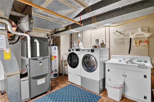 930 Valleyview Rd, Mt Lebanon, PA 15243 - laundry room with water heater, washing machine and dryer, cabinet space, and concrete block wall