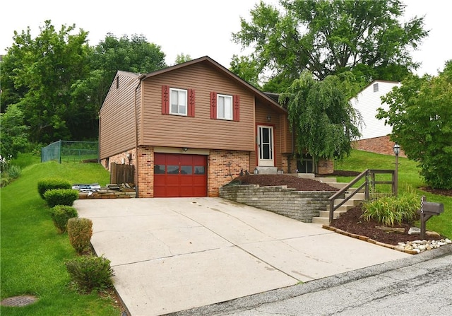 4095 Overlook St, South Park, PA 15129 - split level home featuring brick siding, an attached garage, and concrete driveway