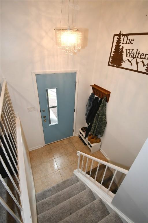 4095 Overlook St, South Park, PA 15129 - tiled entrance foyer featuring stairs and a chandelier
