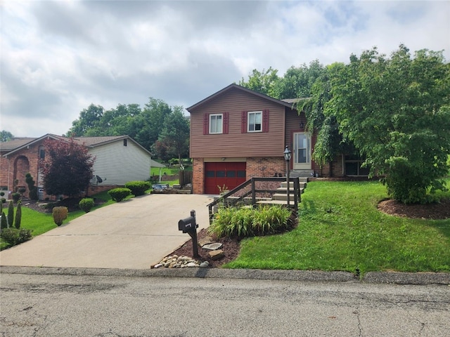 4095 Overlook St, South Park, PA 15129 - tri-level home with brick siding, driveway, an attached garage, and a front yard
