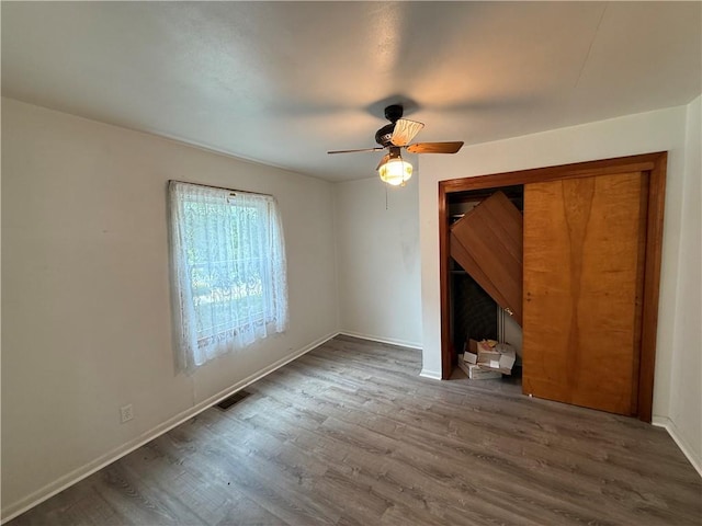 3170 Dutch Ridge Rd, Brighton Twp, PA 15009 - unfurnished bedroom with wood finished floors, ceiling fan, and a closet