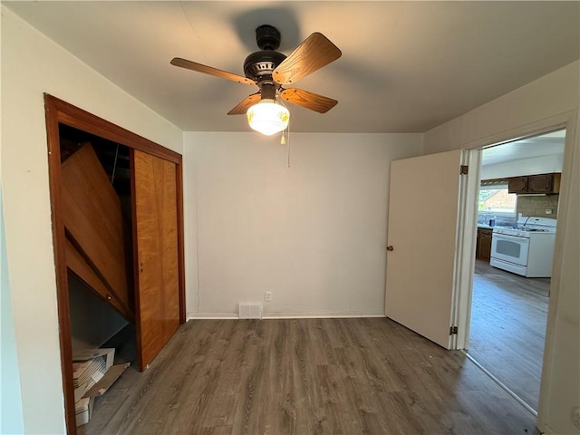 3170 Dutch Ridge Rd, Brighton Twp, PA 15009 - unfurnished bedroom featuring wood finished floors, a closet, and a ceiling fan